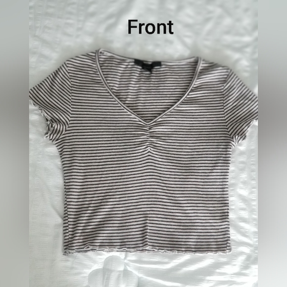 Small, light pink, light grey, white and black ruffly top. - Picture 1 of 9